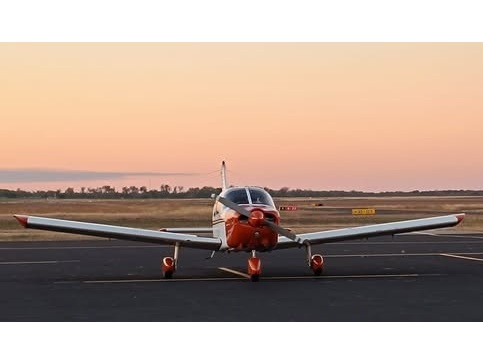 Training airplane at sunset on the ramp
